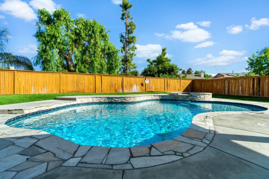 Custom backyard pool by California Custom Pools.