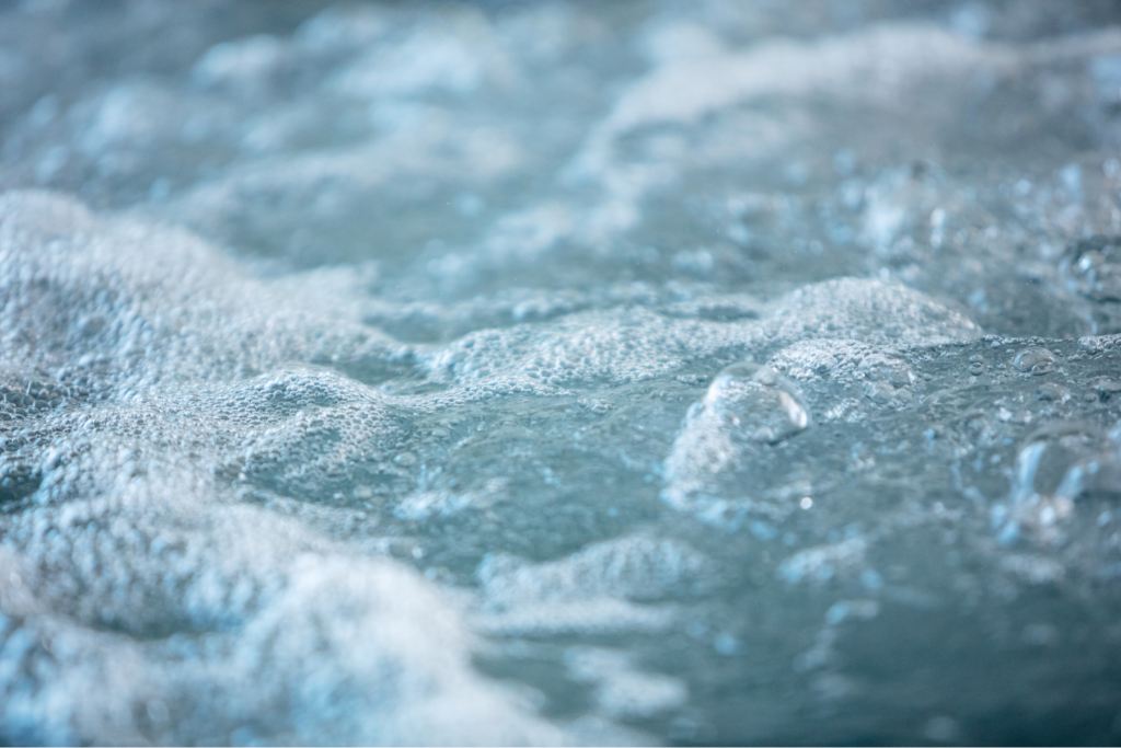 Close-up of bubbling water in a California Custom Pool hot tub.